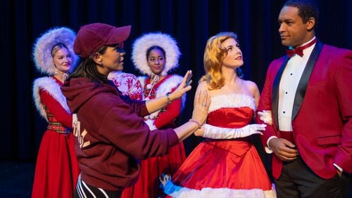 Sara Edwards works through one of the many scenes of 'White Christmas" with the cast at City Springs Theatre.