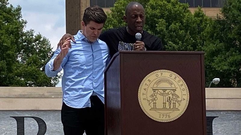 OneRace Movement co-founder Billy Humphrey (left) and co-executive director, Bishop Garland Hunt (right), pray during a 90-minute rally at Liberty Plaza on Monday, June 1, 2020.