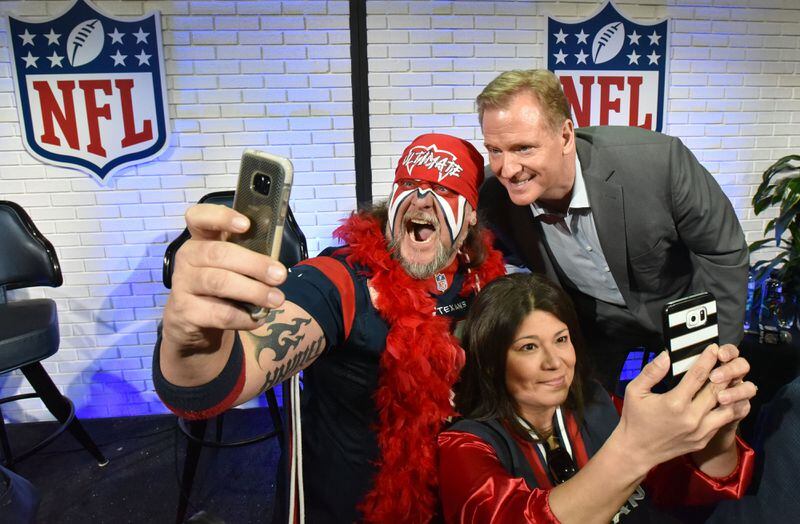  NFL Commissioner Roger Goodell takes a selfie with some energetic fans. AJC photo: Hyosub Shin