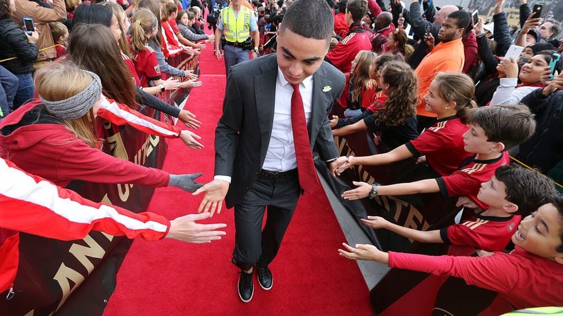 Nov 25, 2018 Atlanta: Atlanta United midfielder Miguel Almiron is greeted by fans along the red carpet arriving to play the New York Red Bulls in their Eastern Conference finals MLS soccer game on Sunday, Nov. 25, 2018, in Atlanta.   Curtis Compton/ccompton@ajc.com