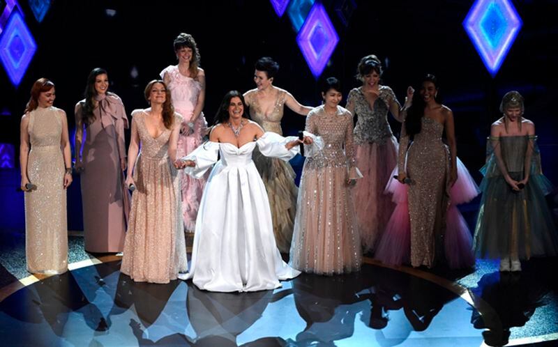 Idina Menzel, center, performs with international voice actresses that play Elsa in the movie "Frozen II" at the Oscars on Sunday, Feb. 9, 2020, at the Dolby Theatre in Los Angeles. (AP Photo/Chris Pizzello)