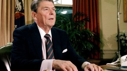 President Ronald Reagan, shown here in January 1986, signed landmark tax reform legislation in October 1986. Comparisons to that legislation are being made to tax bills now before Congress. (Associated Press)