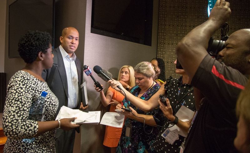 Atlanta school board vice chair Eshe’ Collins (left) and board chairman Jason Esteves talk to the media and parents after they announced that the board would not extend superintendent Meria Carstarphen’s contract, during a special meeting at the APS headquarters in downtown Atlanta on Monday, Sept. 9, 2019. (Photo by Phil Skinner).