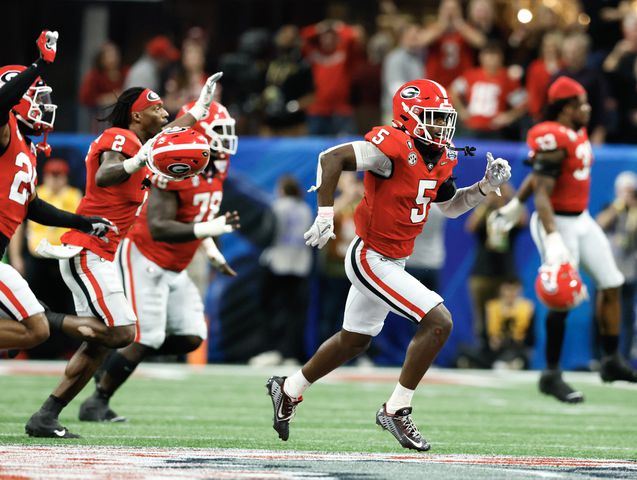 Georgia players react after Ohio State missed a field game to give Georgia the win at the end of the College Football Playoff Semifinal between the Georgia Bulldogs and the Ohio State Buckeyes at the Chick-fil-A Peach Bowl In Atlanta on Saturday, Dec. 31, 2022.  Georgia won, 42-41. (Jason Getz / Jason.Getz@ajc.com)