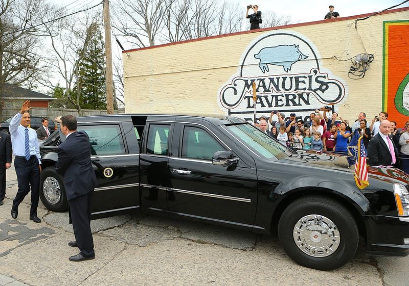 President Barack Obama waves to the crowd as he leaves Manuel’s Tavern after a 2015 visit. Curtis Compton/AJC file