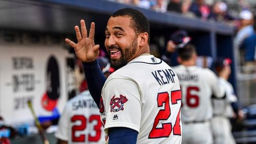 Atlanta Braves' Matt Kemp waves to a fan after the team's baseball game against the Milwaukee Brewers on Saturday, June 24, 2017, in Atlanta. The Braves won 3-1. (AP Photo/Danny Karnik)
