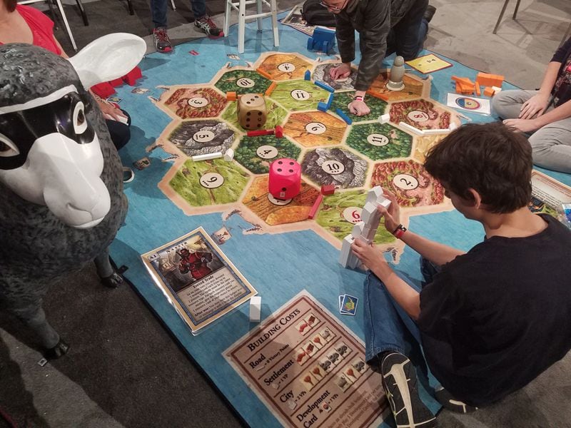 Players learn the classic boardgame ‘Settlers of Catan’ on a massive version of the board at SXSW Gaming Expo. WILL HARRISON FOR THE STATESMAN