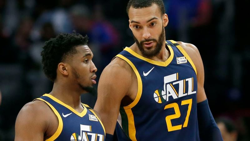 Utah Jazz center Rudy Gobert (27) and guard Donovan Mitchell  have tested positive for the coronavirus.  Gobert's test result forced the NBA to suspend the season.