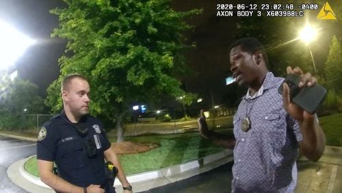 This screen grab taken from body camera video provided by the Atlanta Police Department on June 12, 2020, shows Rayshard Brooks, right, speaking with Officer Garrett Rolfe in the parking lot of a Wendy's restaurant, prior to being fatally shot by Rolfe. (Atlanta Police Department/Zuma Press/TNS)