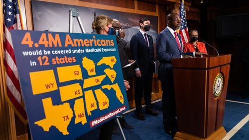 Georgia U.S. Sen. Raphael Warnock speaks at a press conference on Medicaid expansion with other democratic lawmakers Thursday on Capitol Hill in Washington.