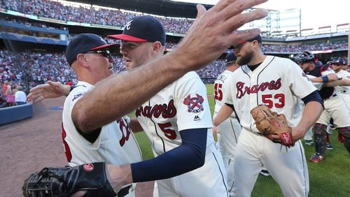 Braves manager Brian Snitker (left) and slugger Freddie Freeman say team isn’t panicking or losing confidence after 6-12 start. (Curtis Compton /ccompton@ajc.com)