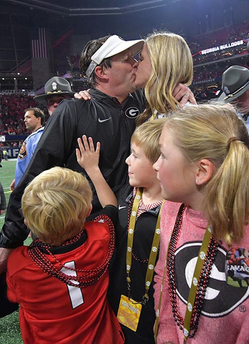 Georgia head coach Kirby Smart celebrates with his wife Mary Beth and children during the Southeastern Conference championship win.