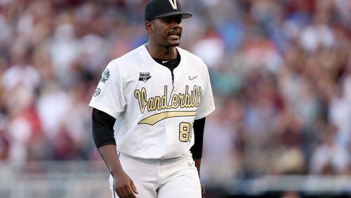 Starting pitcher Kumar Rocker (80) of Vanderbilt reacts to being pulled from the game against Mississippi State by head coach Tim Corbin in the top of the fifth inning during game three of the College World Series Championship at TD Ameritrade Park Omaha on June 30, 2021 in Omaha, Nebraska. (Sean M. Haffey/Getty Images/TNS)