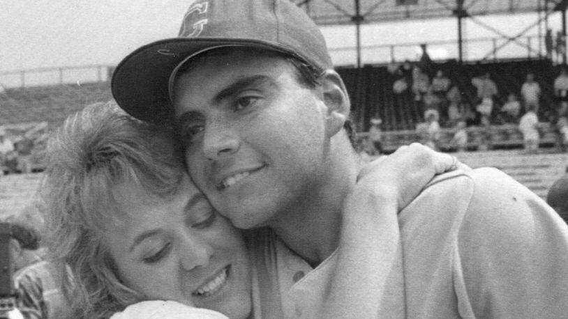 Georgia pitcher Mike Rebhan gets a hug from his wife, Patricia, after he was named MVP of the 1990 College World Series in Omaha, Neb.