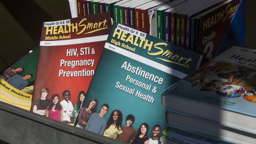 Comprehensive sexual and health education textbooks and learning materials are photographed on Wednesday, March 8, 2023, at Gwinnett County Schools Headquarters in Suwanee, Georgia. The materials are being considered for use in Gwinnett County's sexual education curriculum. CHRISTINA MATACOTTA FOR THE ATLANTA JOURNAL-CONSTITUTION. 