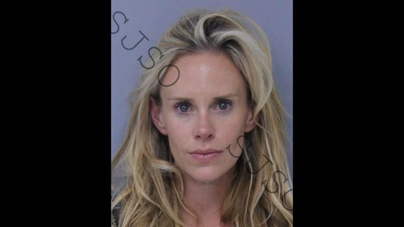 Krista Glover, wife of pro-golfer Lucas Glover, was arrested Saturday on domestic violence charges and released on a $2,500 bond on Sunday.