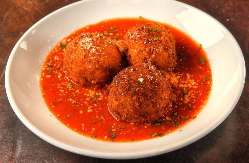 Toscano's antipasto menu includes Arancini di Riso con bufala e manzo (rice balls filled with fresh mozzarella and beef, breaded, fried and served with tomato sauce). (Chris Hunt for The Atlanta Journal-Constitution)