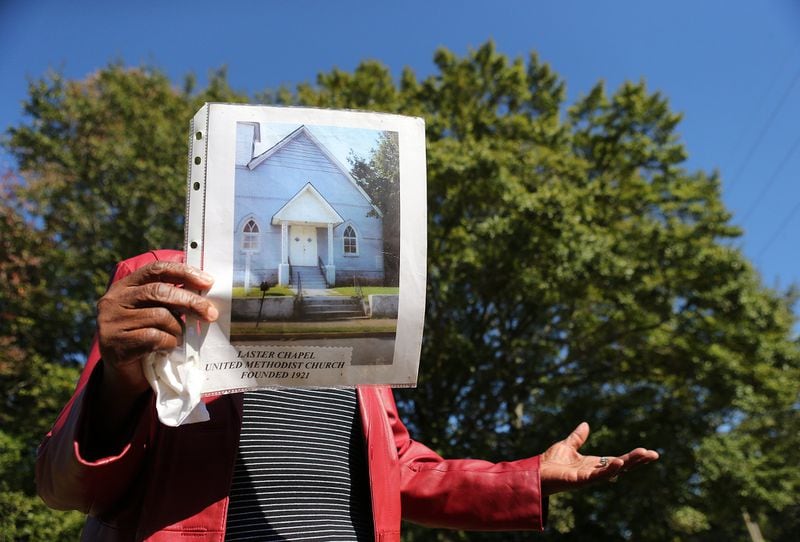 Emma Schell Dudley, 88, holds a photo of Laster Chapel United Methodist Church she attended on the site it once stood where a large scale development is planned on Wednesday, October 23, 2019, in College Park. Curtis Compton/ccompton@ajc.com
