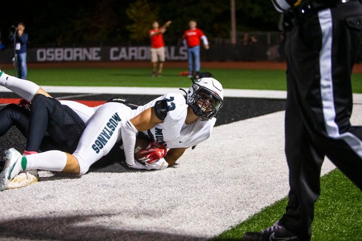 Michael Bell, strong safety for Kennesaw Mountain, makes an interception against Osborne on Friday, October 7, 2022 in Marietta. Kennesaw Mountain defeated Osborne 49-0. CHRISTINA MATACOTTA FOR THE ATLANTA JOURNAL-CONSTITUTION.
