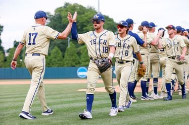 Georgia Tech coach Danny Hall (17) congratulates his players after beating UNC Wilmington 3-1 and advancing in the NCAA Tournament Regional at Foley Field on Sunday, June 2, 2024, in Athens. 
(Miguel Martinez / AJC)