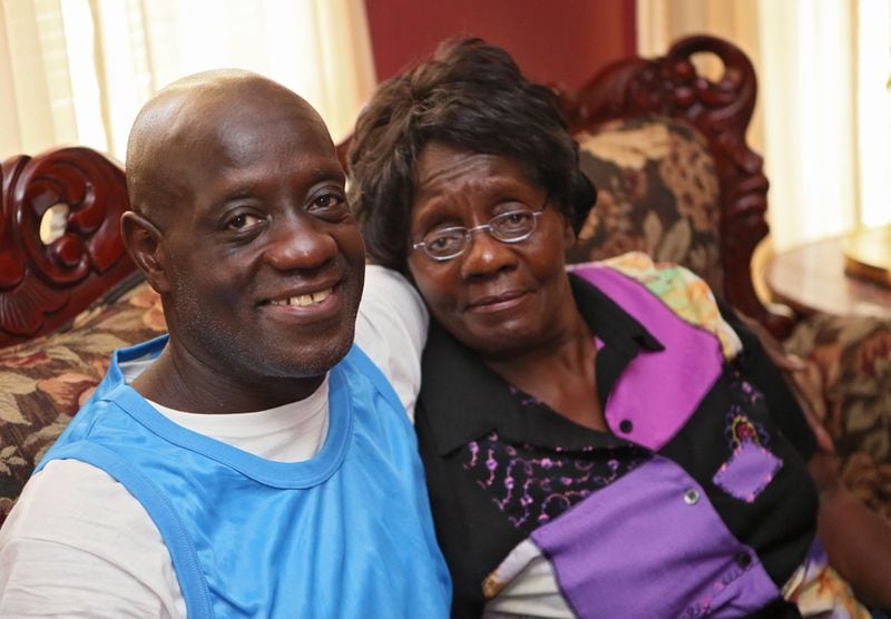 July 30, 2015 - Macon - Darion Barker, photographed with his mother, Ella Jackson at her house in Macon. When Georgia decided that lock 'em up and throw away the key was the right approach for repeat felons, Darion Barker was among those whose cell key was tossed. He got busted four times in the early 1990s for drug offenses. As a "recidivist" who was giving a life sentence by a Bibb County judge for possession with the intent to distribute, he was not eligible for parole. EVER. Until just a few weeks ago. A new state law kicked in that allowed Barker and a few others to be considered for release by the parole board. Today, the man who thought Georgia's tough stance had sealed his fate inside the system, is today at home with his mother. He's 50 and spent 20 in prison. BOB ANDRES / BANDRES@AJC.COM