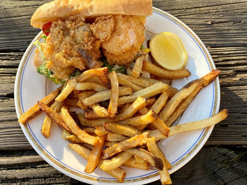 Biggerstaff’s loaded po’boy is stacked with fried oysters, shrimp and calamari. Wendell Brock for The Atlanta Journal-Constitution