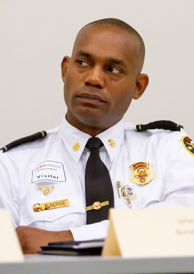 Jolyon Bundrige, Deputy Chief of EMS of the Atlanta Fire Rescue Department, listens to other council members talk during a meeting of the regional EMS council in Marietta in May. 