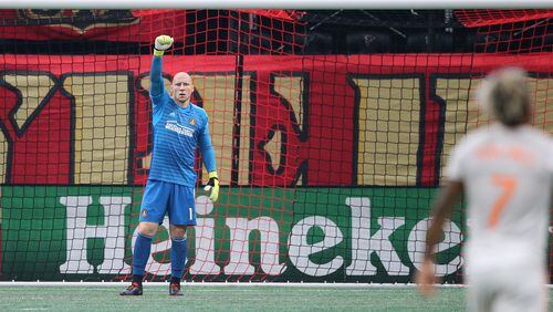August 19, 2018 Atlanta: Atlanta United goalkeeper Brad Guzan salutes Josef Martinez after he scores the MLS season tieing record goal number 27 against the Columbus Crew in a MLS soccer match on Sunday, August 19, 2018, in Atlanta.  Curtis Compton/ccompton@ajc.com