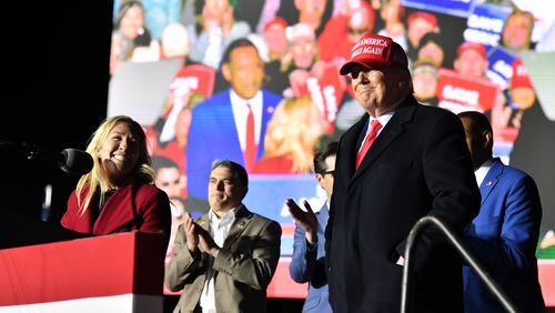 March 26, 2022 Commerce - U.S. Rep. Marjorie Taylor Greene thanks to former President Donald Trump during a rally for Georgia GOP candidates at Banks County Dragway in Commerce on Saturday, March 26, 2022. (Hyosub Shin / Hyosub.Shin@ajc.com)