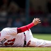 Atlanta Braves shortstop Orlando Arcia (11) holds the ball high after tagging out Cleveland Guardians' Tyler Freeman at second base in the fourth inning of a baseball game, Sunday, April 28, 2024, in Atlanta. (AP Photo/Mike Stewart)