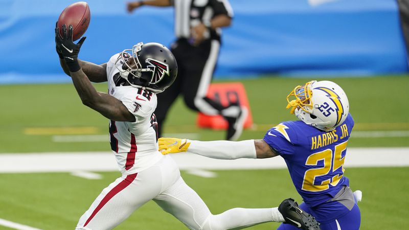 Atlanta Falcons wide receiver Calvin Ridley (18) catches a touchdown pass from wide receiver Russell Gage in front of Los Angeles Chargers cornerback Chris Harris Jr. during the first half Sunday, Dec. 13, 2020, in Inglewood, Calif. (Ashley Landis/AP)