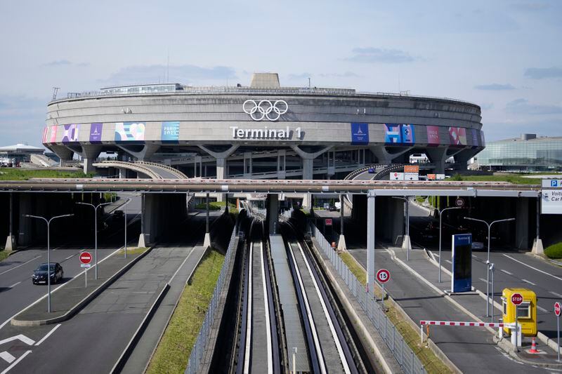 The Charles de Gaulle airport, terminal 1, where the olympic rings were installed, is seen in Roissy-en-France, north of Paris, Tuesday, April 23, 2024 in Paris. (AP Photo/Thibault Camus)