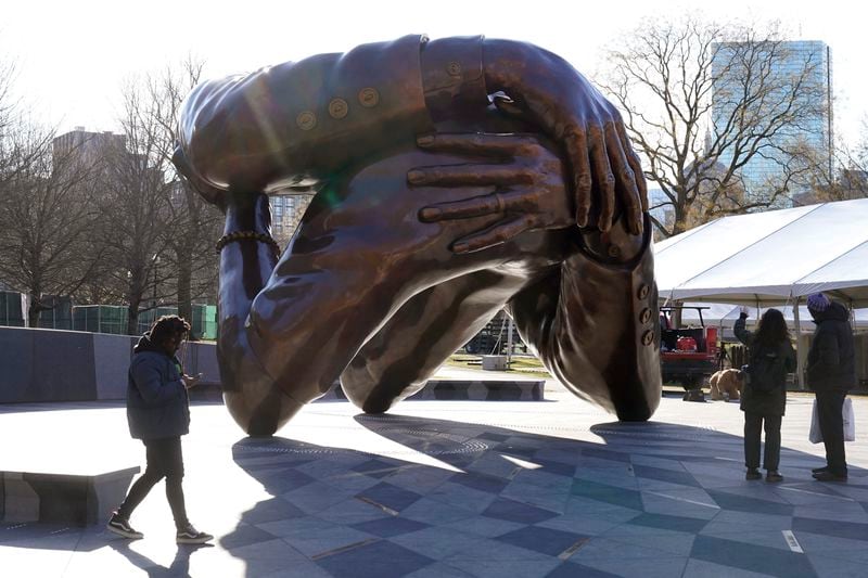 The statue by artist Hank Willis Thomas entitled "The Embrace" in the Boston Common. (Steve Senne / AP)