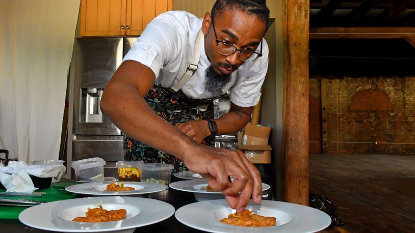 Chef Demetrius Brown prepared fried flatbread topped with marmalade as the sixth course of A Dinner at 29, an eight-course meal for the Heritage Supper Club designed to honor his Trinidadian great-grandmother, Elizabeth Castle. (CHRIS HUNT FOR THE ATLANTA JOURNAL-CONSTITUTION)