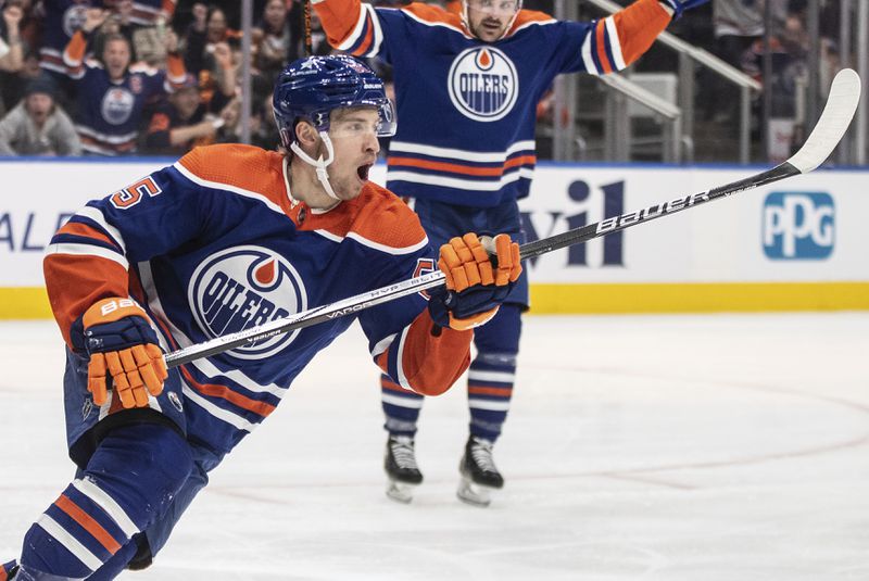 Edmonton Oilers' Dylan Holloway (55) celebrates a goal against the Los Angeles Kings during the second period of Game 2 of an NHL hockey Stanley Cup first-round playoff series Wednesday, April 24, 2024, in Edmonton, Alberta. (Jason Franson/The Canadian Press via AP)