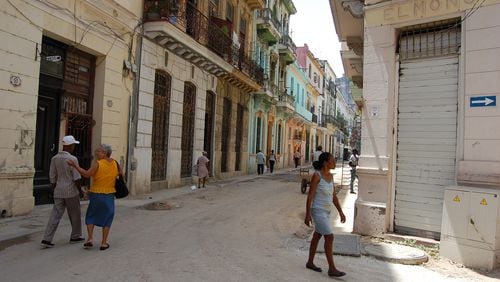 A woman walks in Old Havana on Sunday, June 28, 2015. (KATIE LESLIE / KLESLIE@AJC.COM)