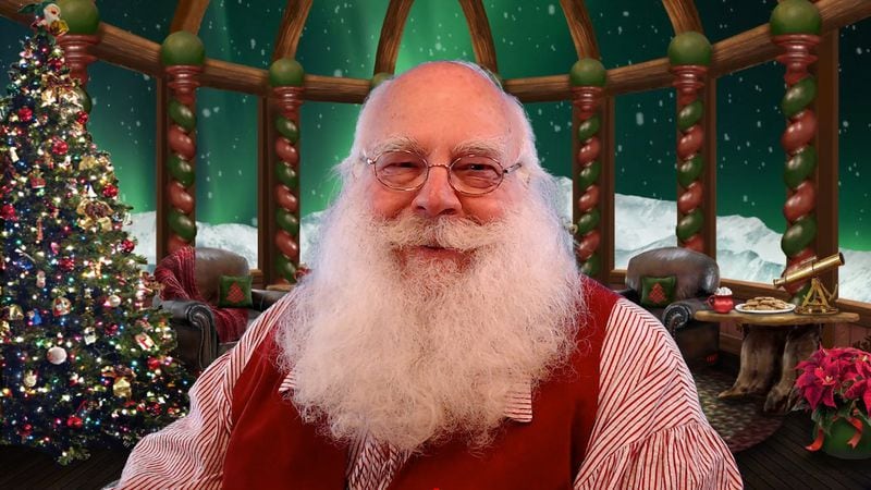 “Santa Ed” Taylor of Medford, Oregon, uses a computer platform developed by a metro Atlanta couple to hold online visits with children across the country.