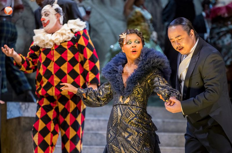 From left, Rigoletto (George Gagnidze), Countess Ceprano (Amanda Sheriff) and the Duke of Mantua (Won Whi Choi) share the stage in "Rigoletto." Photo: Rafterman / Courtesy of the Atlanta Opera