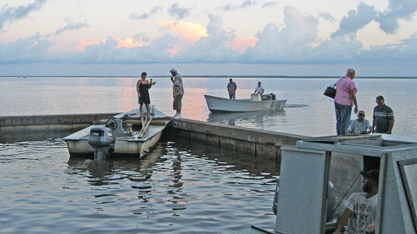 Oystermen head out early from Eastpoint, Fla. for a day of fishing in the Apalachicola Bay. DAN CHAPMAN / DCHAPMAN@AJC.COM