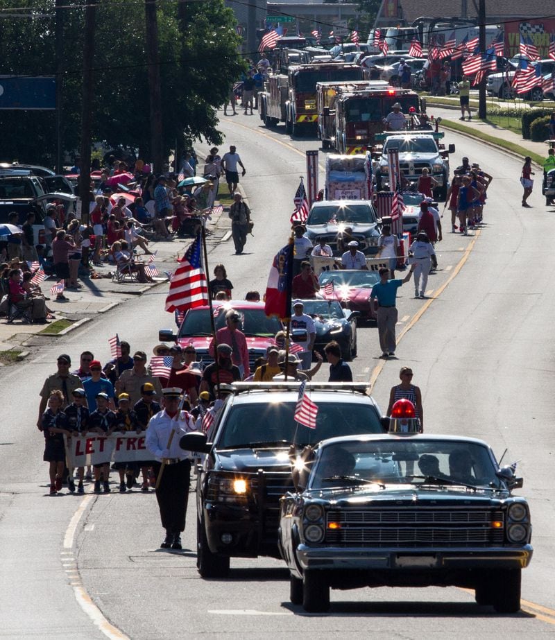 The Marietta Freedom Parade makes its way down Roswell Street on Tuesday, July 4, 2016, In Marietta, GA. An estimated 30,000 spectators turned out for the parade. STEVE SCHAEFER / SPECIAL TO THE AJC