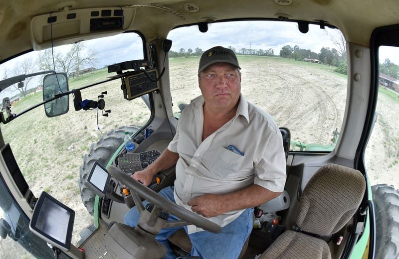 April 8, 2019 Meigs - Ken Hickey operates a John Deere utility tractor as he prepares his cotton field at Hickey Farms in Meigs on Monday, April 8, 2019.  Congress' delay in finalizing an aid package for Hurricane Michael victims has had a real impact on the ground in Georgia. HYOSUB SHIN / HSHIN@AJC.COM