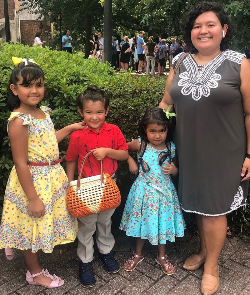 Maria Del Rosario Palacios with her three children. She says Gainesville wouldn’t be “The Poultry Capital of the World” without undocumented immigrants. (Photo courtesy Rosario Palacios)