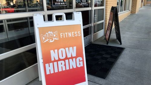 Signs advertise openings at a Crunch Fitness gym in Dunwoody on Thursday, April 21, 2022. J. SCOTT TRUBEY