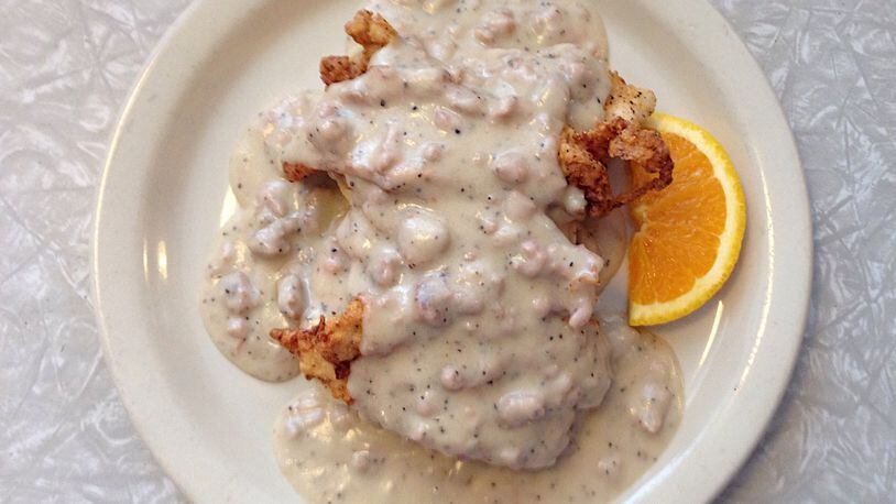 The Comfy Chicken Biscuit at Home Grown consists of fried chicken tenders and sausage gravy on open-faced biscuits. CONTRIBUTED BY WYATT WILLIAMS