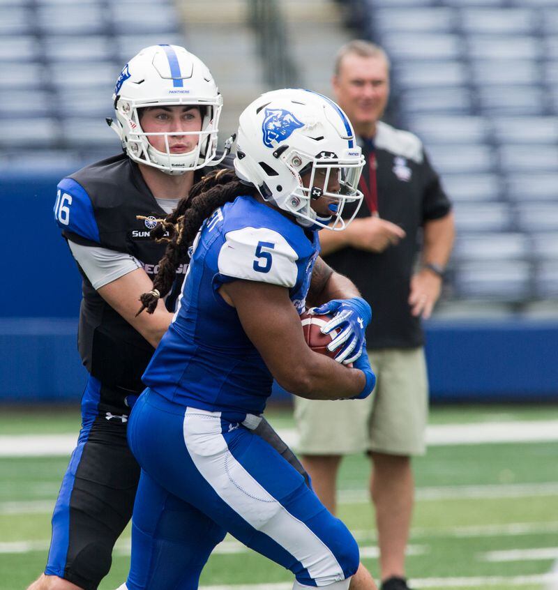 Quarterback #16 Swift Lyle handed off to #5 Tra Barnett as Panther fans got their first look at the 2019 Georgia State University football team in action during the annual Blue-white Spring Game at Georgia State Stadium in Atlanta on Saturday April 13th, 2019. (Photo by Phil Skinner)