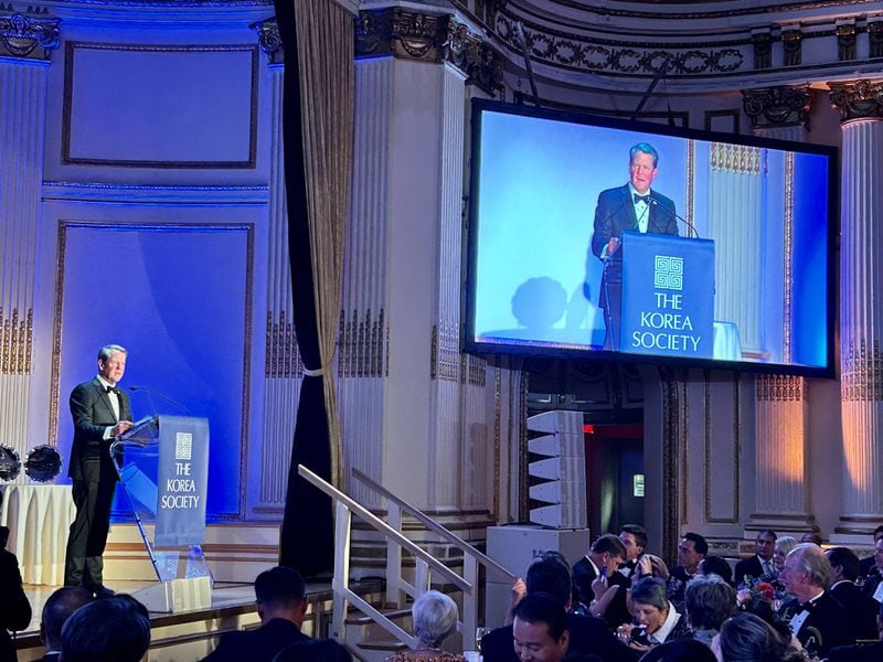 Gov. Brian Kemp, left, speaks during the annual Korea Society dinner in New York City in September. The state was honored with the Gen. James A. Van Fleet Award to mark its growing economic ties with South Korea.