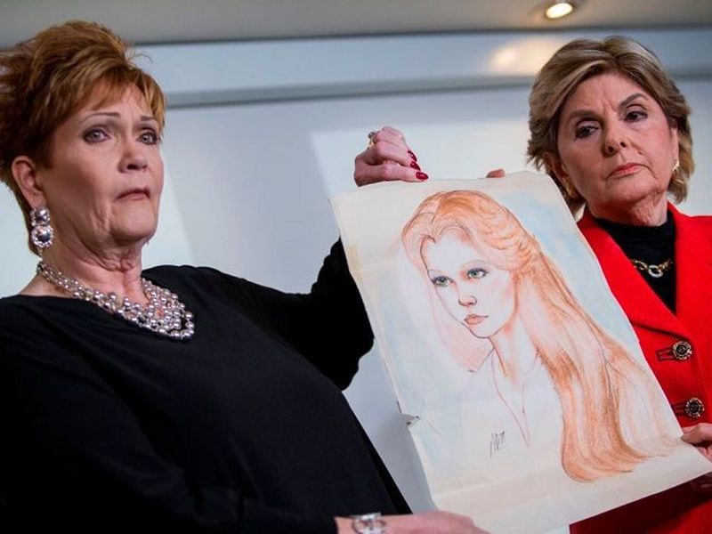 Attorney Gloria Allred (R) and Beverly Young Nelson hold up a drawing of Nelson when she was younger during a press conference on November 13, 2017, in New York, alledging that Roy Moore sexually assaulted Nelson when she was a minor in Alabama without her consent.The US Senate's top Republican on Monday urged scandal-hit conservative Roy Moore to end his Senate campaign,  saying he believes the women who have accused the Christian evangelical candidate of sexual misconduct. / AFP PHOTO / EDUARDO MUNOZ ALVAREZ        (Photo credit should read EDUARDO MUNOZ ALVAREZ/AFP/Getty Images)