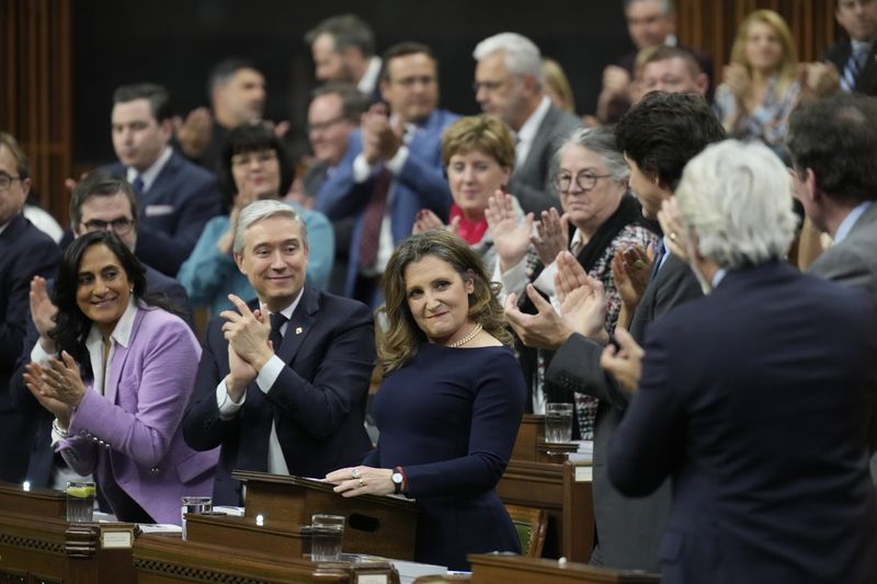 Canada's Deputy Prime Minister and Minister of Finance Chrystia Freeland, center, presents the federal budget in the House of Commons in Ottawa, Ontario, on Tuesday, April 16, 2024. The Liberal government has already unveiled significant planks of the budget, including billions of dollars to build more homes, expand child care and beef up the military. (Adrian Wyld/The Canadian Press via AP)