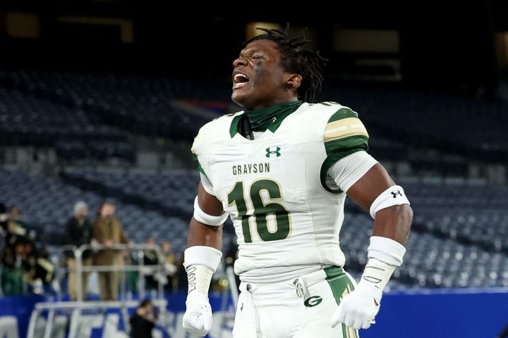 Dec. 30, 2020 - Atlanta, Ga: Grayson defensive back Jayvian Allen celebrates after making an interception in the first half against Collins Hill during the Class 7A state high school football final at Center Parc Stadium Wednesday, December 30, 2020 in Atlanta. JASON GETZ FOR THE ATLANTA JOURNAL-CONSTITUTION