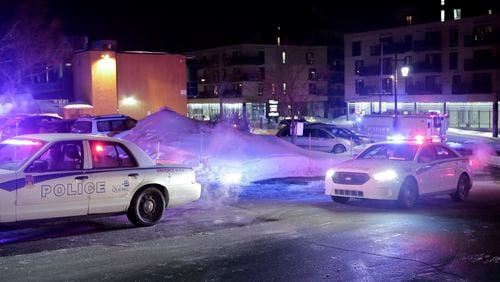Police survey the scene after deadly shooting at a mosque in Quebec City, Canada, Sunday, Jan. 29, 2017. Quebec Premier Philippe Couillard termed the act "barbaric violence" and expressed solidarity with victims' families. (Francis Vachon/The Canadian Press via AP)